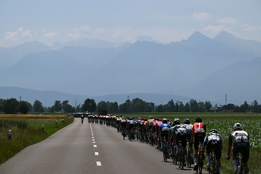 A general view of the peloton competing during the 88th Tour de Suisse, Stage 4 a 193.2km stage from Heiden to Piuro (Valchiavenna) / #UCIWT / on June 18, 2025 in Piuro, Switzerland. (Photo by Tim de Waele/Getty Images)