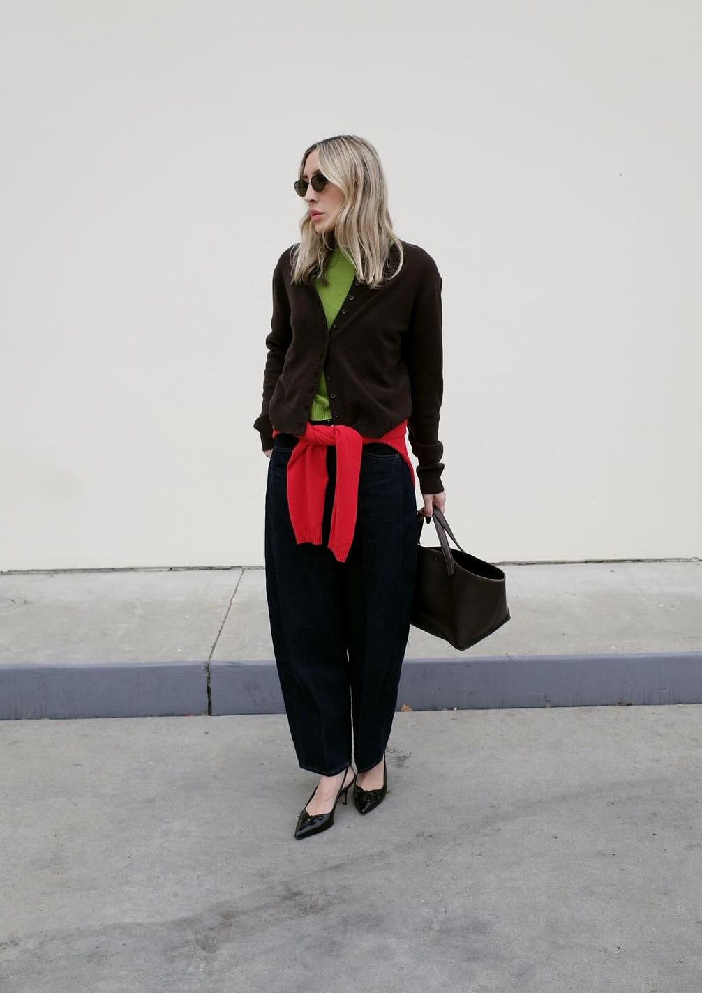 Influencer wearing a red and green outfit