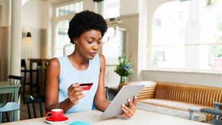 woman using a tablet to shop