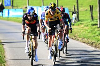 NINOVE, BELGIUM - FEBRUARY 26: (L-R) Wout Van Aert of Belgium and Tiesj Benoot of Belgium and Team Jumbo - Visma compete during the 77th Omloop Het Nieuwsblad 2022 - Men's Race a 204,2km race from Ghent to Ninove / #OHN22 / @FlandersClassic / #WorldTour / on February 26, 2022 in Ninove, Belgium. (Photo by Vincent Kalut - Pool/Getty Images)