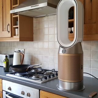 The Dyson Purifier Hot + Cool Formaldehyde HP09 Fan Heater being tested on a worktop in a kitchen