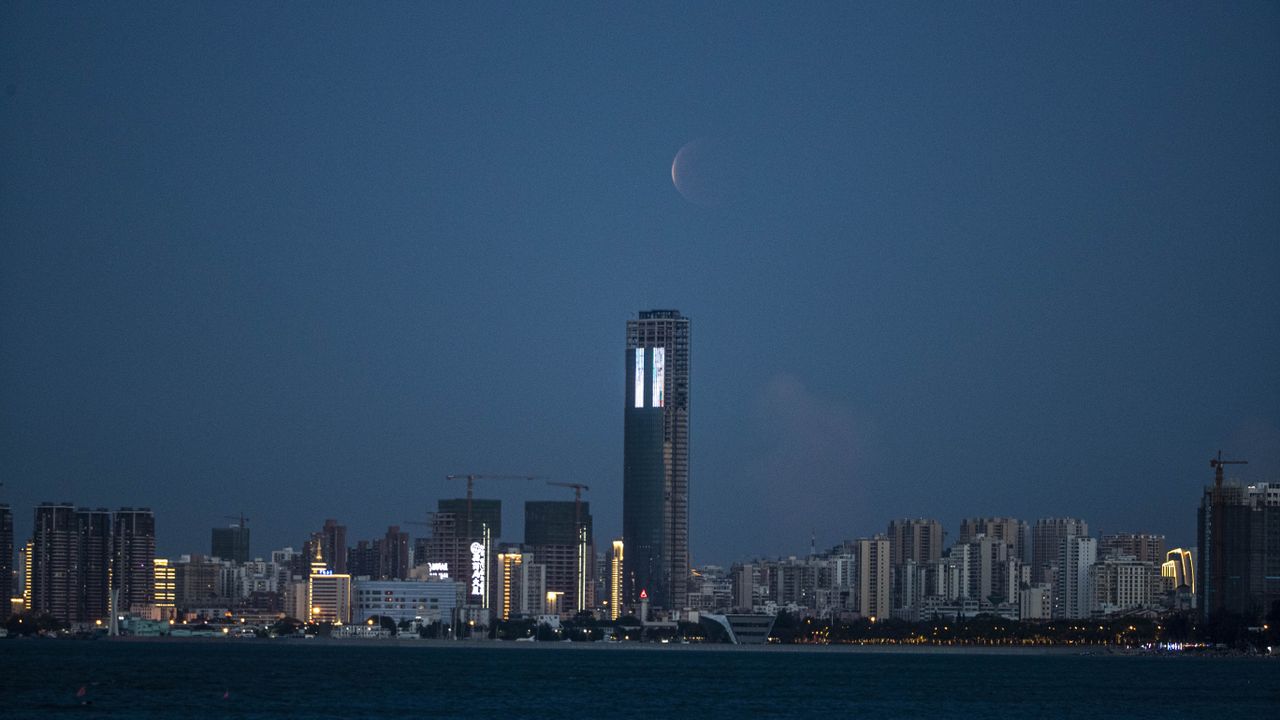 The total lunar eclipse of May 26, 2021, as seen above Haikou, in China's Hainan Province.