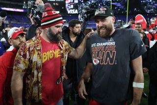 Travis Kelce #87 of the Kansas City Chiefs celebrates with his brother Jason Kelce after a 17-10 victory against the Baltimore Ravens in the AFC Championship Game at M&T Bank Stadium on January 28, 2024 in Baltimore, Maryland.