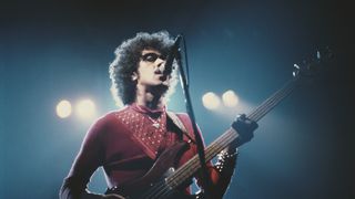 Irish musician Phil Lynott (1949 - 1986) of rock group Thin Lizzy, in concert, 1986