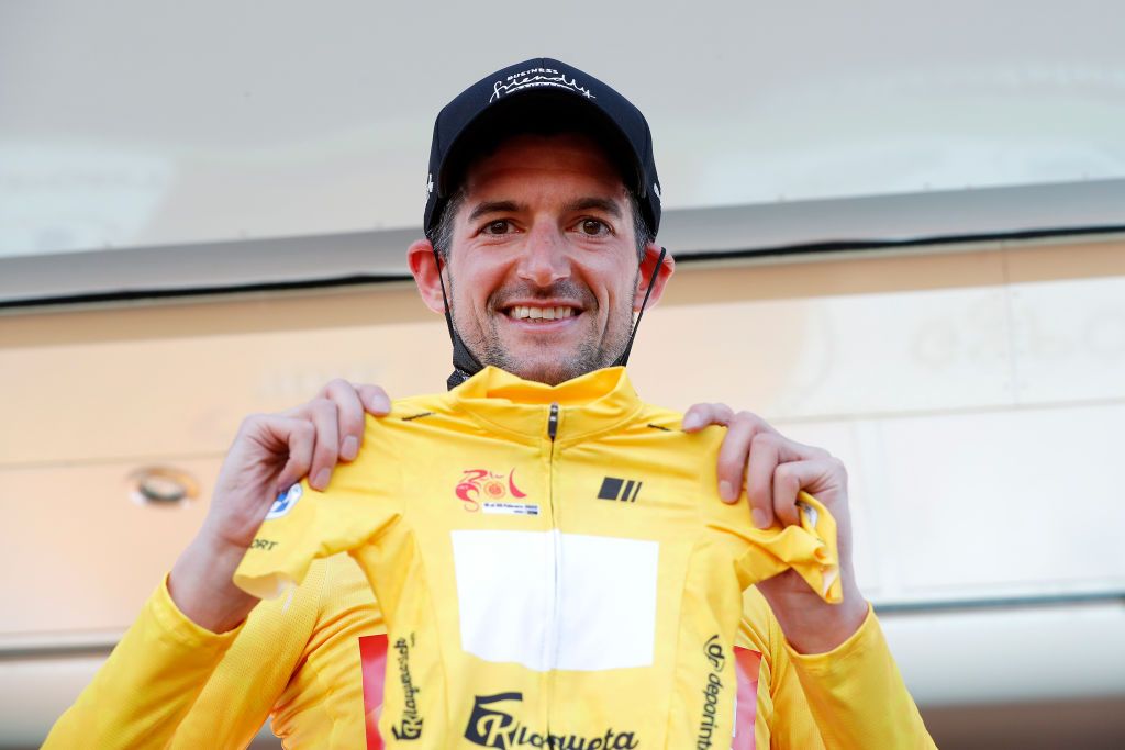 CHICLANA DE SEGURA SPAIN FEBRUARY 20 Wouter Poels of Netherlands and Team Bahrain Victorious celebrates winning the yellow leader jersey on the podium ceremony after the 68th Vuelta A Andalucia Ruta Del Sol 2022 Stage 5 a 1644km stage from Huesa to Chiclana De Segura 870m 68RdS on February 20 2022 in Chiclana De Segura Spain Photo by Bas CzerwinskiGetty Images