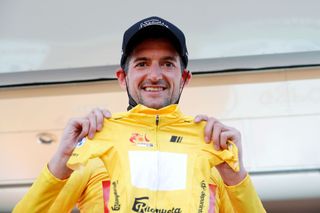 CHICLANA DE SEGURA SPAIN FEBRUARY 20 Wouter Poels of Netherlands and Team Bahrain Victorious celebrates winning the yellow leader jersey on the podium ceremony after the 68th Vuelta A Andalucia Ruta Del Sol 2022 Stage 5 a 1644km stage from Huesa to Chiclana De Segura 870m 68RdS on February 20 2022 in Chiclana De Segura Spain Photo by Bas CzerwinskiGetty Images
