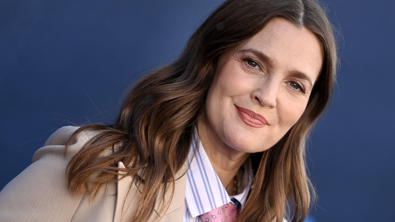 drew barrymore on a blue background