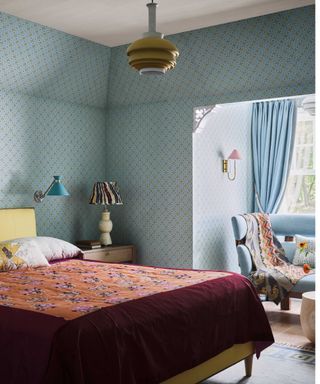 Blue bedroom with burgundy bedding