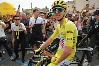 UAE Team Emirates team's Slovenian rider Tadej Pogacar wearing the overall leader's yellow jersey awaits the start of the 3rd stage of the 111th edition of the Tour de France cycling race, 230,5 km between Piacenza and Turin, on July 1, 2024. (Photo by Thomas SAMSON / AFP)