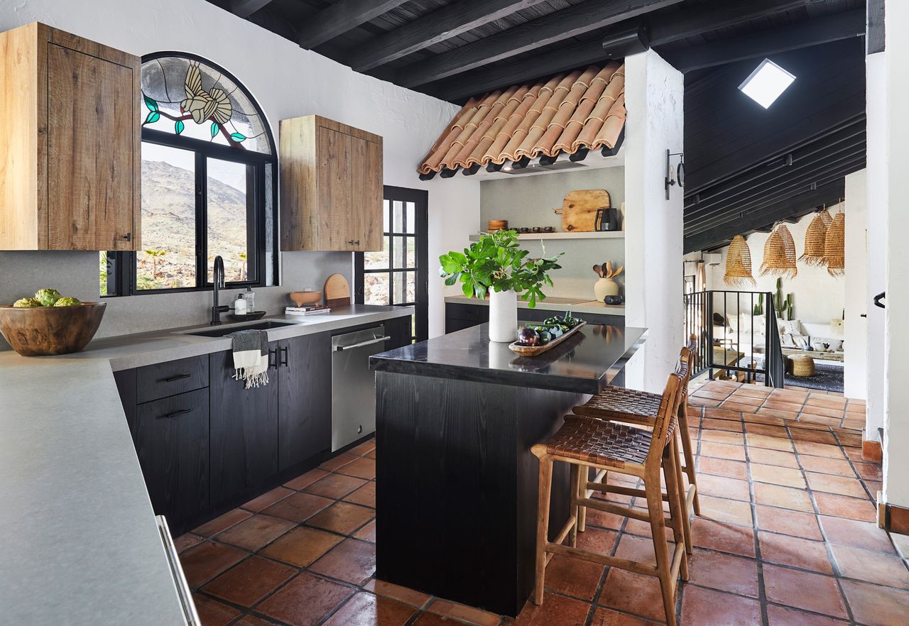 a spanish style kitchen with a modern twist