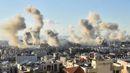 Smoke billows above Beirut's southern suburbs following an Israeli airstrike just one day before a ceasefire was announced