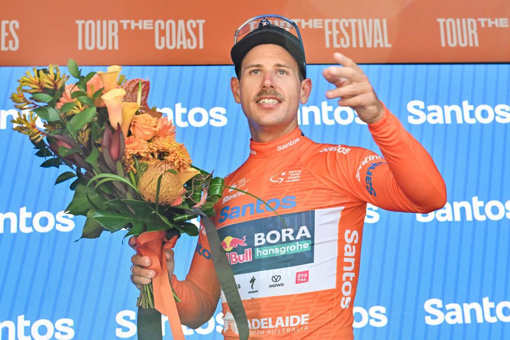 Red Bull-Bora-Hansgrohe rider Australia's Sam Welsford celebrates on the podium after winning stage two of the Tour Down Under cycling race in Adelaide on January 22, 2025. (Photo by Brenton Edwards / AFP) / -- IMAGE RESTRICTED TO EDITORIAL USE - STRICTLY NO COMMERCIAL USE --