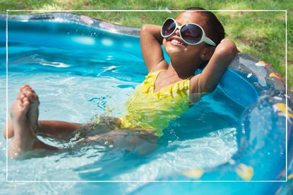Girl in wearing sunglasses striking a relaxed pose in a paddling pool