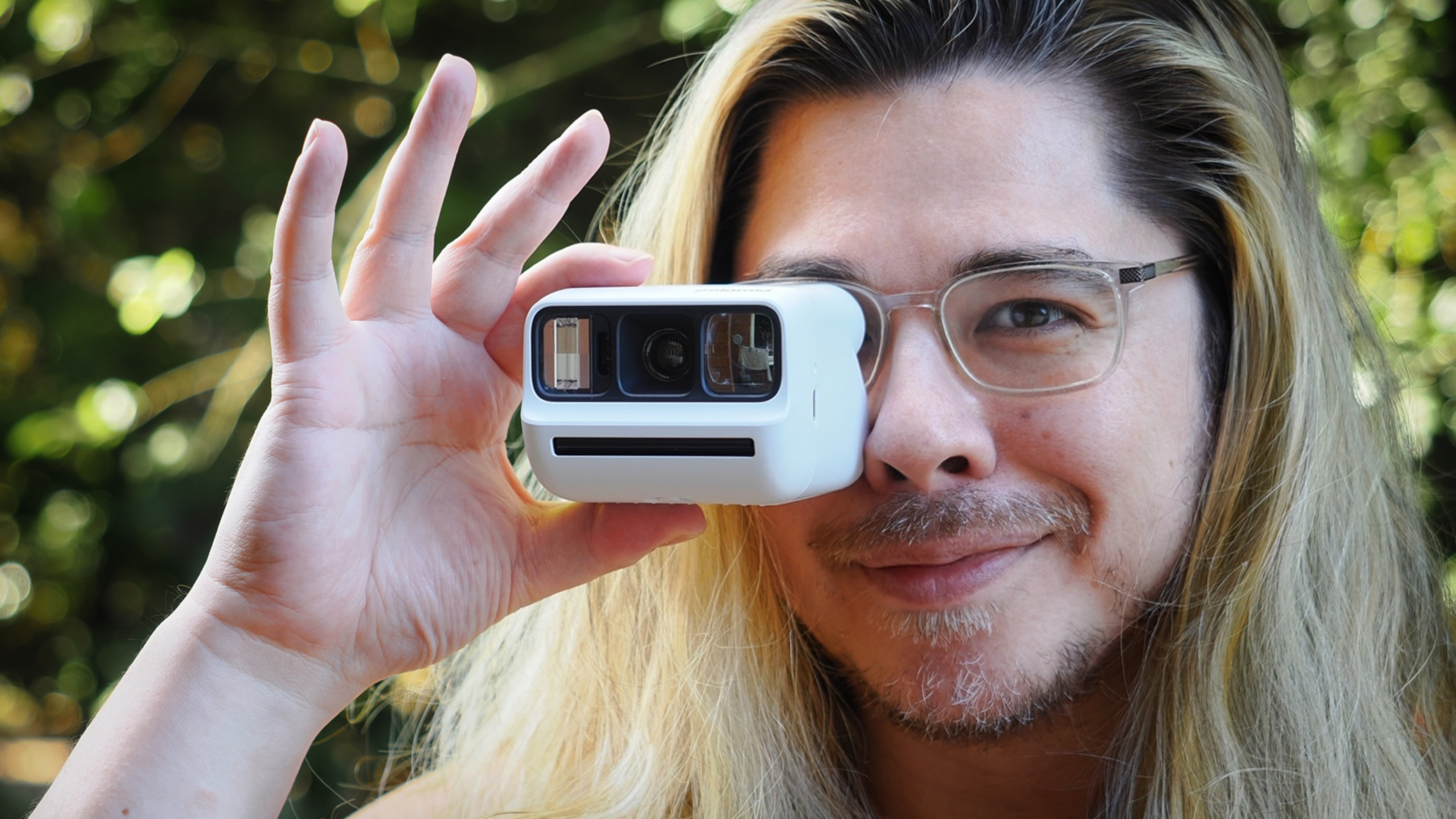 James Artaius using a Polaroid Go Gen 3 outdoors
