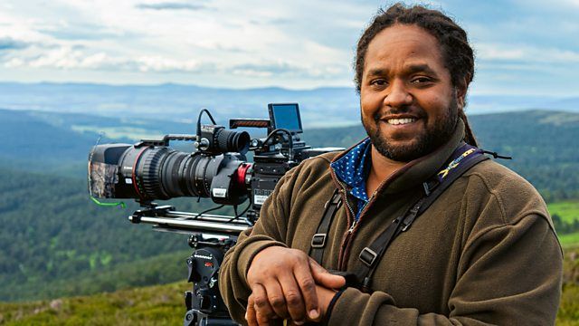 Hamza: Strictly Birds of Prey - Hamza Yassin posing with a camera outdoors