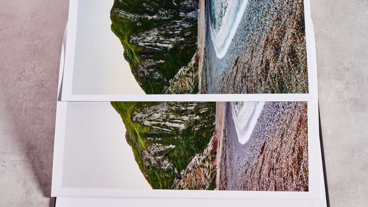 A page from the Snapfish photo book is placed on top of the same page from the Shutterfly book to show the difference in color.