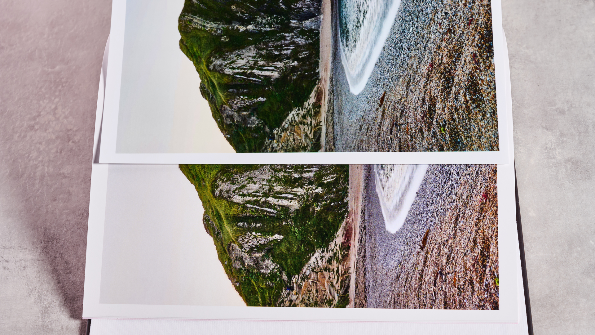 A page from the Snapfish photo book is placed on top of the same page from the Shutterfly book to show the difference in color.