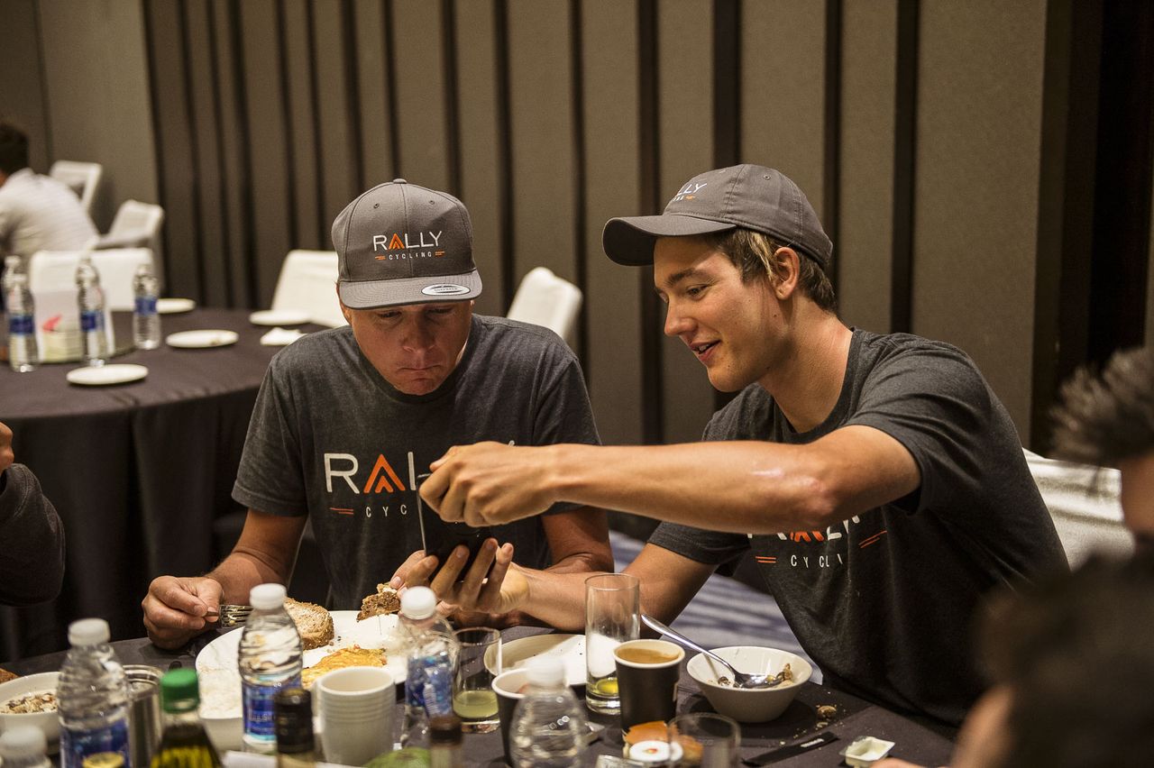 Danny Pate and Adam de Vos chat during a team dinner