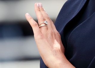 Meghan, Duchess of Sussex (ring detail) travels down The Mall in a horse drawn carriage during Trooping The Colour