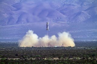 Blue Origin's New Shepard reusable rocket lands during its fourth test flight.