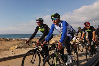 Israeli champion Guy Sagiv leads a group along the Mediterranean coast.