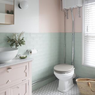 pastel bathroom with traditional toilet and pale blue wall tiles