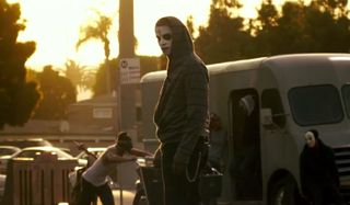 A Purger skateboarding in The Purge: Anarchy.