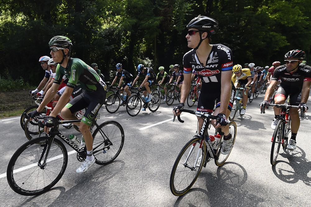 Pierre Rolland (L) rides in the pack during the 228 km fourth stage.