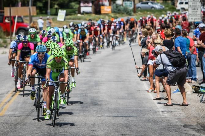 The peloton passes fans along the course.