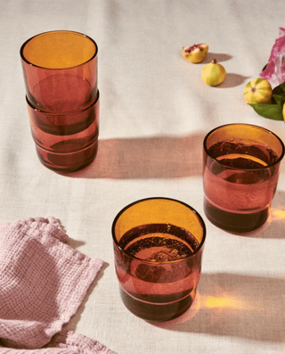 amber glass tumblers on a table