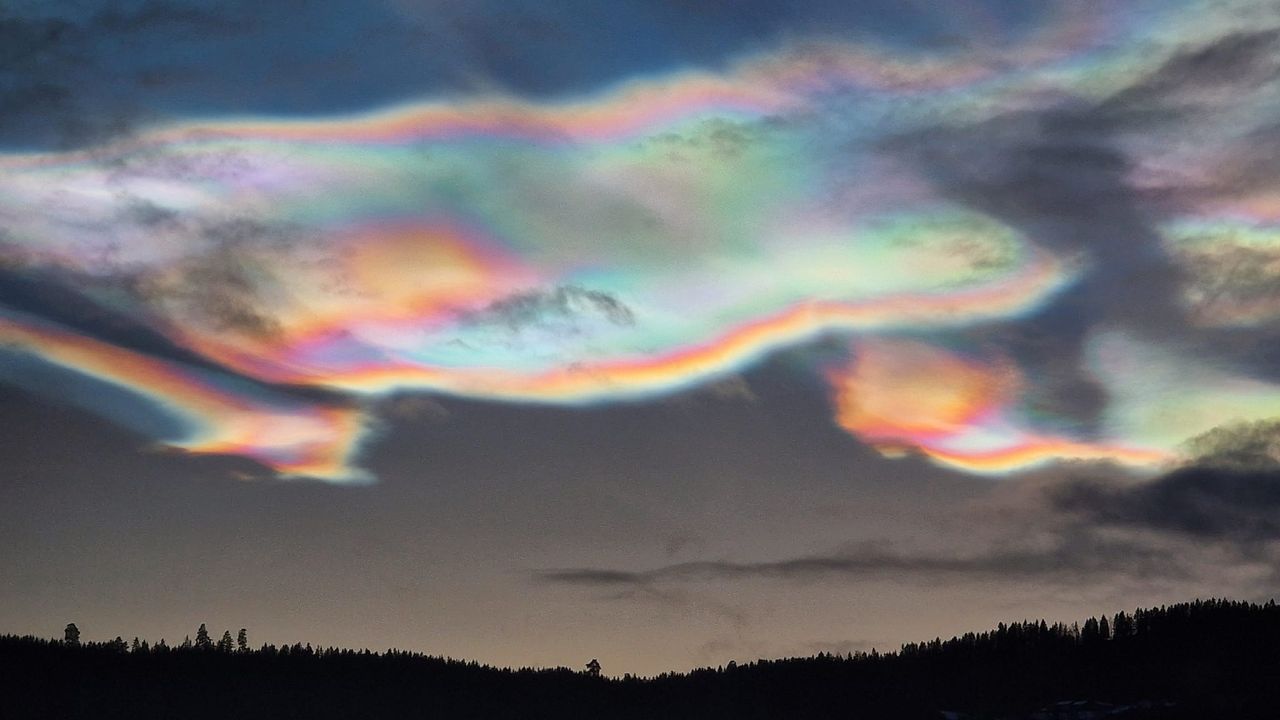 Iridescent, rainbow-colored clouds in the sky