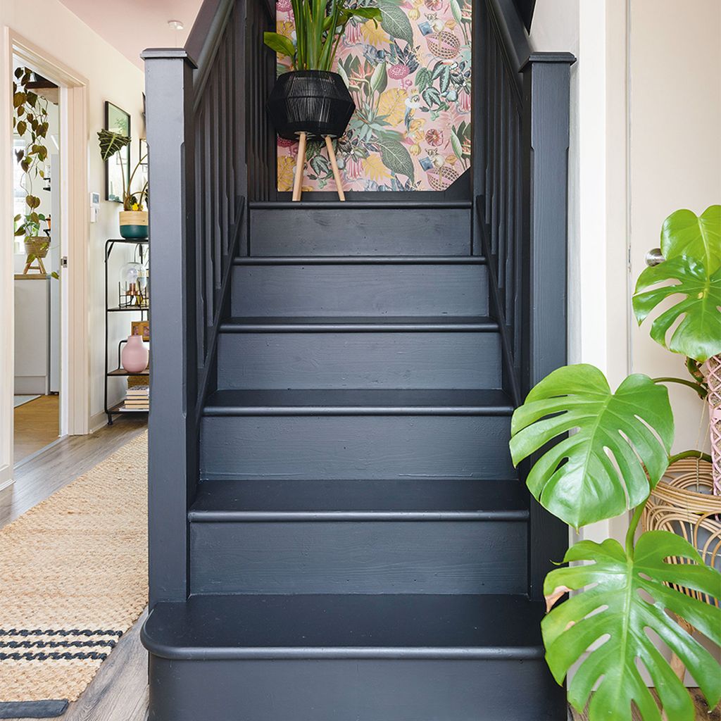 Painting the staircase black has taken this hallway from drab to ...