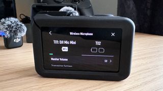 DJI Osmo Action 5 Pro showing battery life for the DJI Mic Mini.