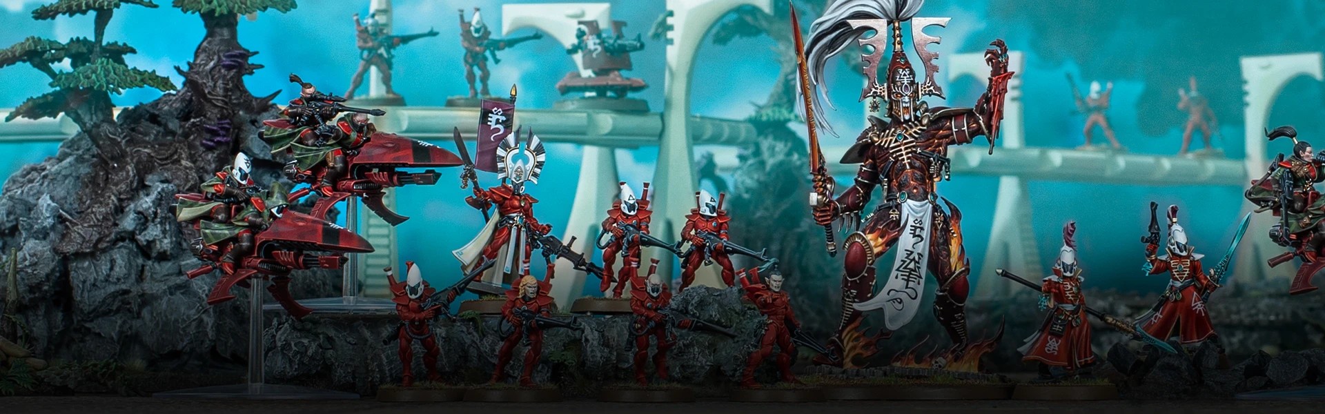 Aeldari warriors led by an Avatar of Khaine march out from a Craftworld