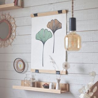 IKEA VÅRDANDE print in a room with a white wooden wall and other home accessories
