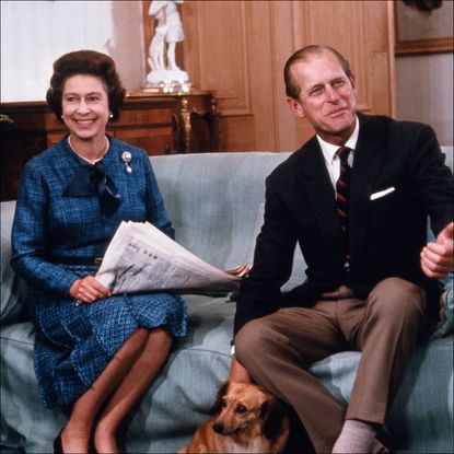 Queen Elizabeth II and Prince Philip relax at Balmoral castle in this 9/76 photo, released when she formally opened Parliament, last month. the year 1977 marks the 25th year of her reign