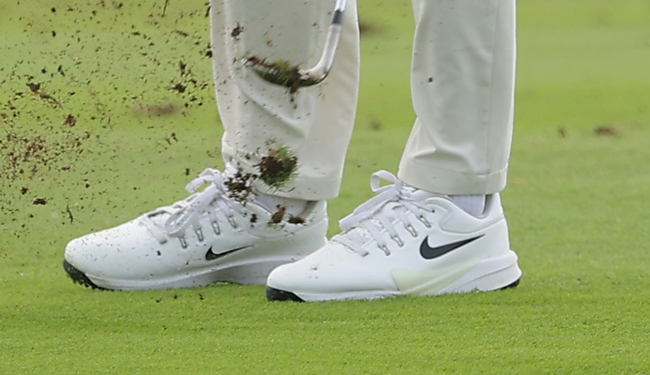 A close up of Scottie Scheffler's golf shoes