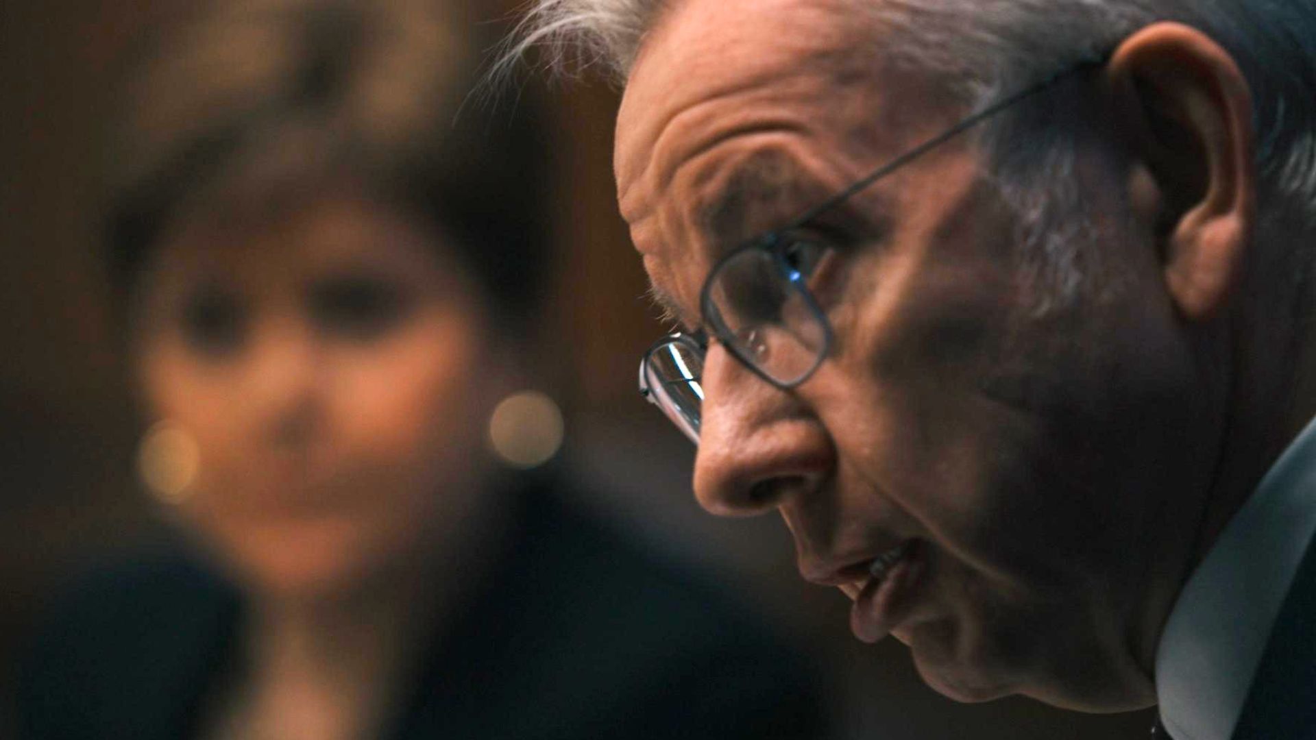Michael Gove with Nicola Sturgeon blurred in the background