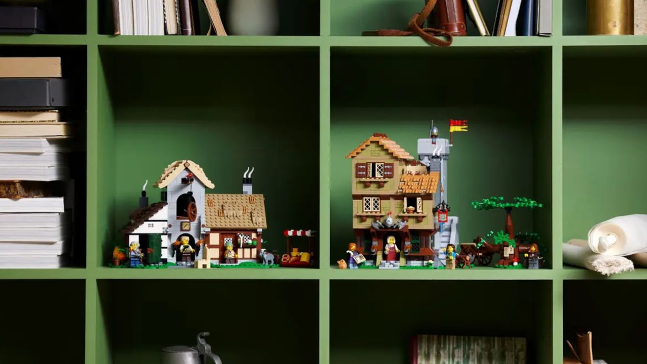 Lego Medieval Town Square buildings on separate, green shelves
