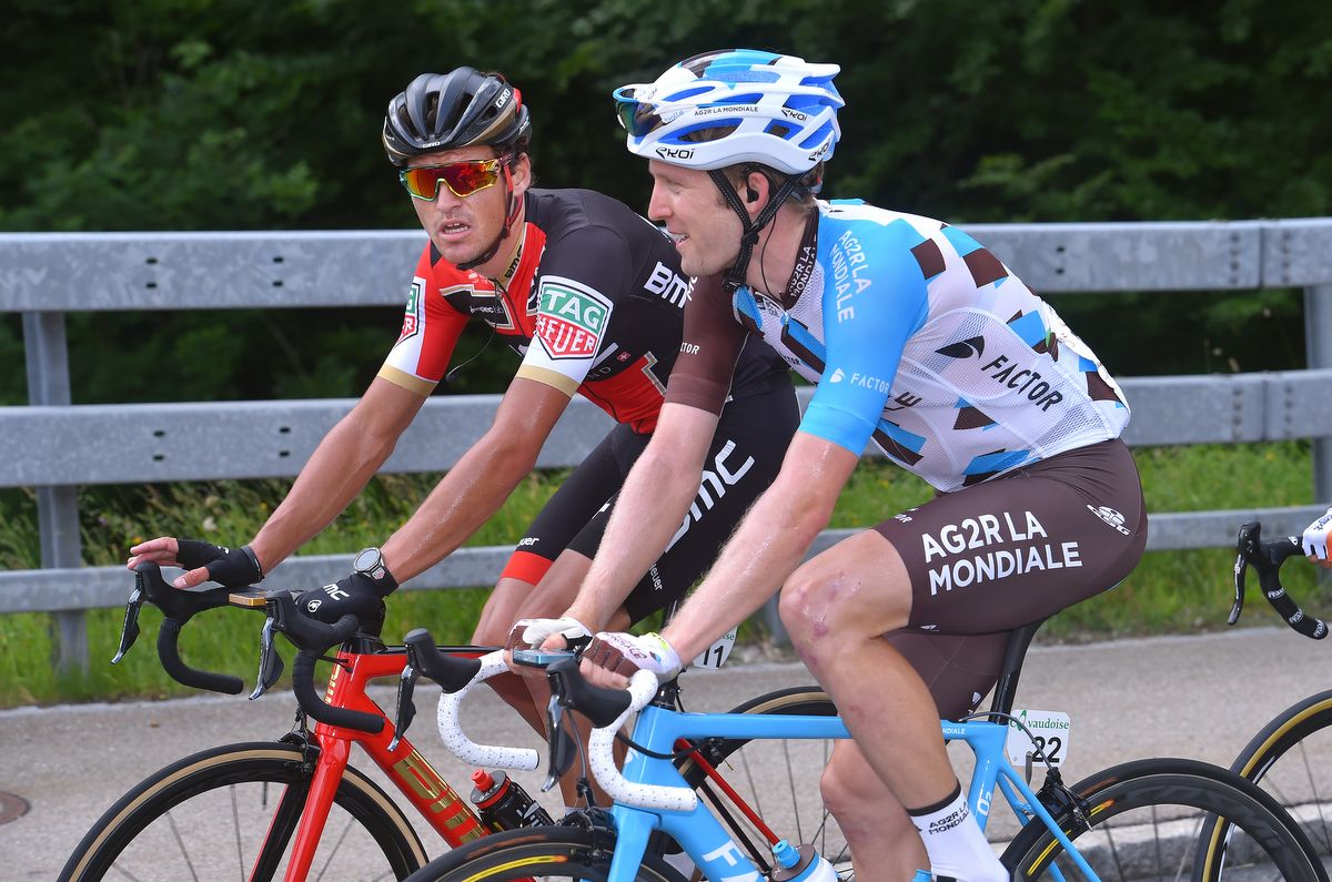 Greg Van Avermaet and Jan Bakelants chat in the bunch.