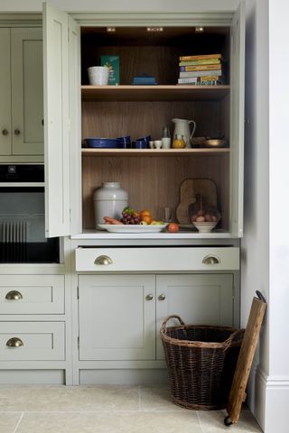 An organized pantry painted in normandy grey