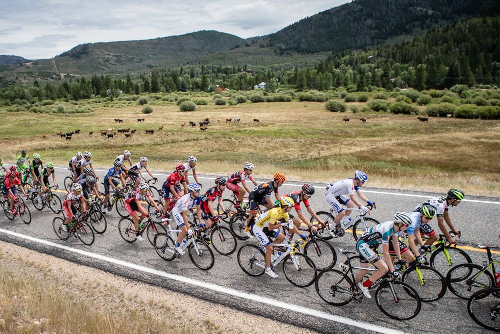 The peloton groups together after a climb.