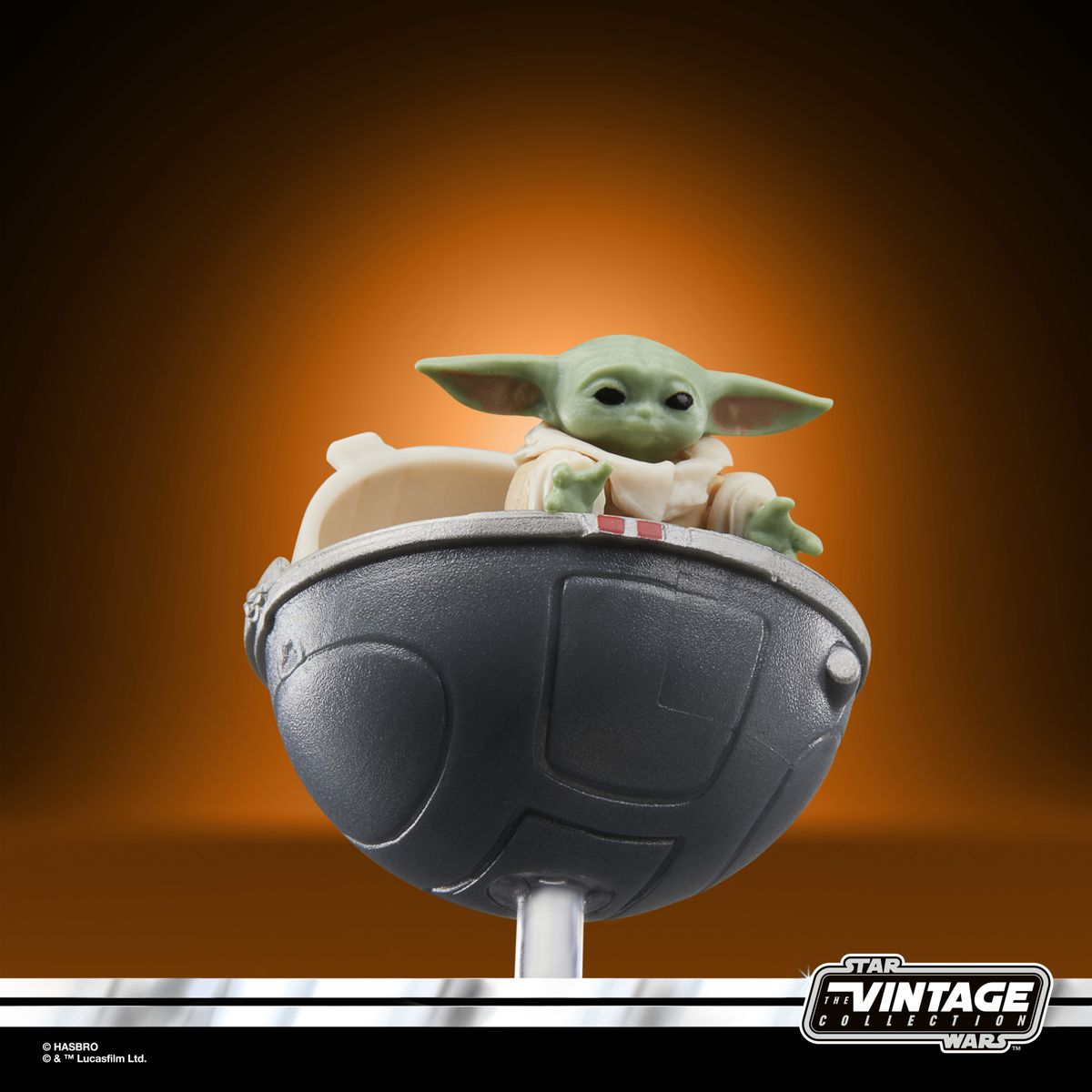 The Vintage Collection Grogu figure on an orange and black background