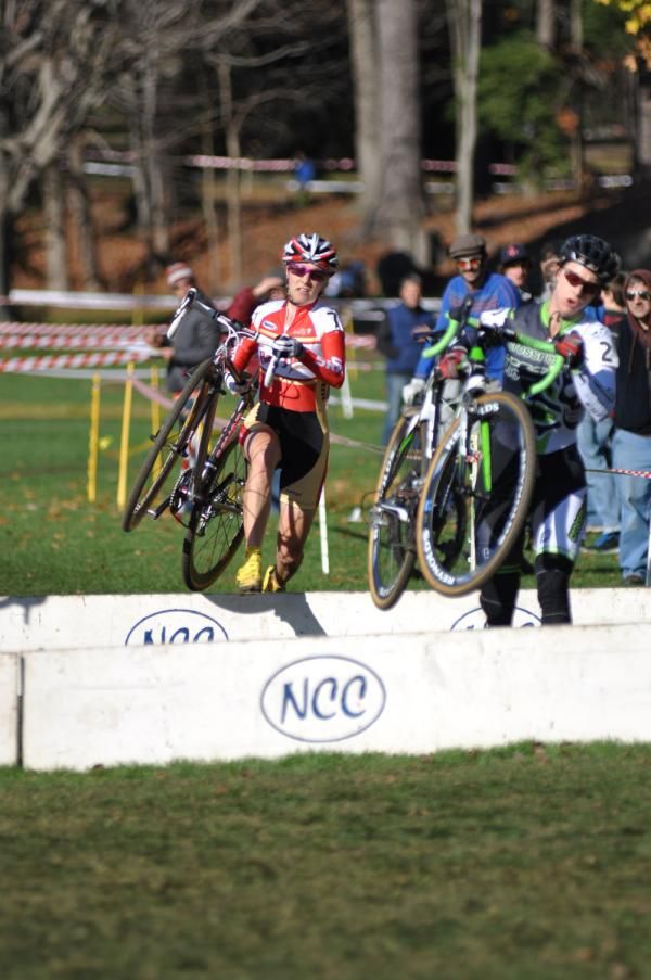 Maureen Bruno Roy (Bob's Red Mill p/b Seven Cycles) follows Sally Annis (crossresults.com/pedalpowercoaching.com) through the barriers.