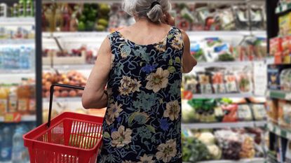 A retired woman grocery shops.
