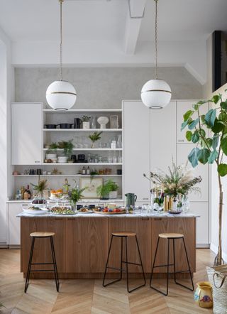 Grey and white kitchen with narrow marble kitchen island