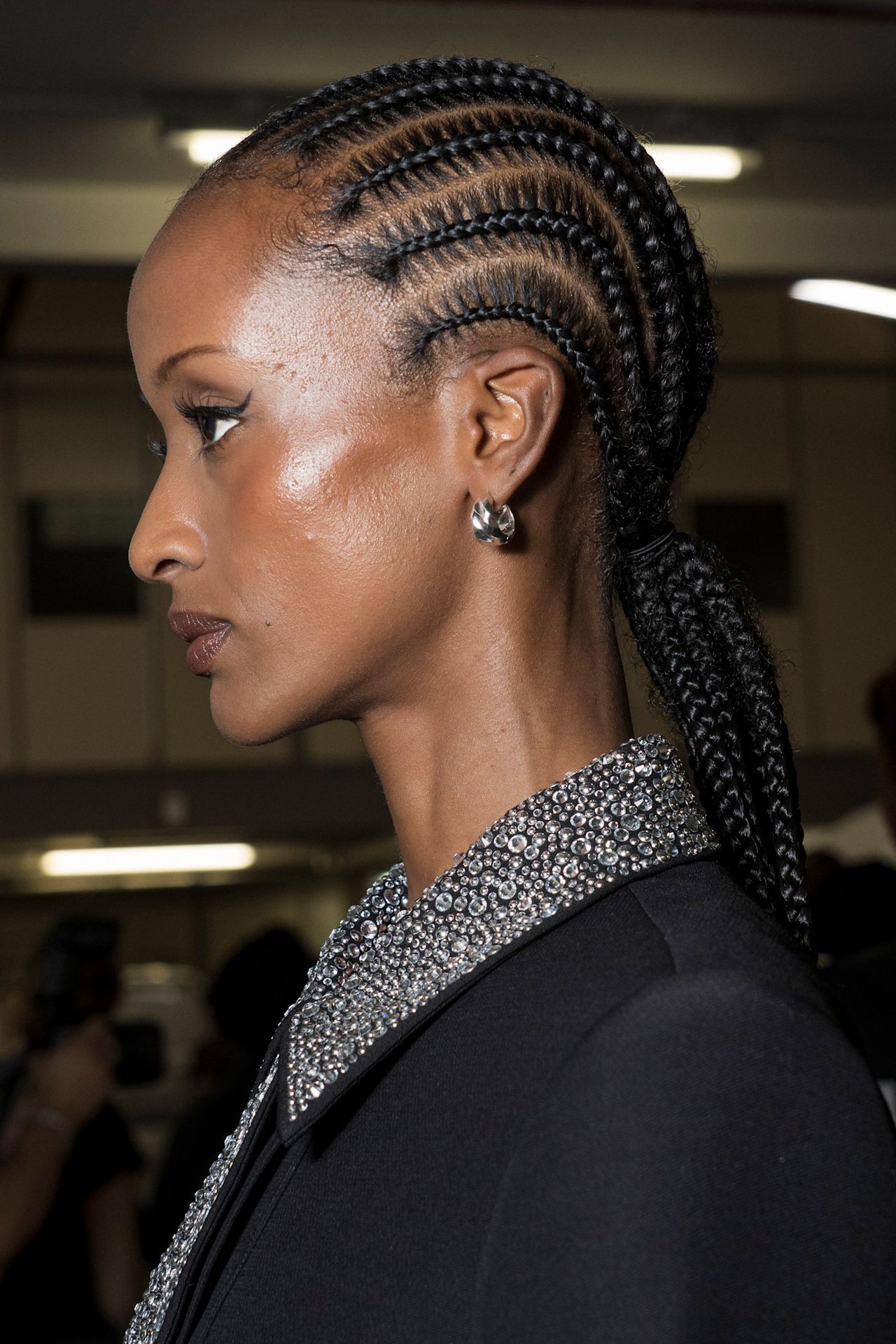 Various women with cornrow-braided hairstyles.