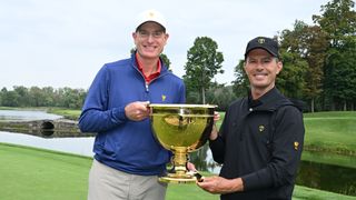 Jim Furyk and Mike Weir pose with the Presidents Cup