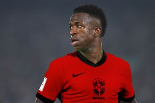 Vinicius Jr in a red Brazil shirt