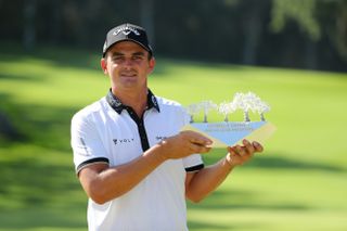 Christiaan Bezuidenhout holds a trophy